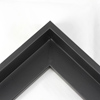 This L-shaped modern canvas floater frame, features a black smooth curved wall.
*Note: These solid wood, custom canvas floaters are for stretched canvas prints and paintings, and raised wood panels.