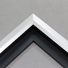 Unique geometric 1 " floater. The face of this molding features an off center peak which gives it a unique contrast in the right lighting. This frame comes in Matte White with a dull satin finish.