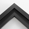 This simplistic yet modular matte black frame is designed for metal prints, acrylic prints and dry mounts. This smart design features a minimalist stepped profile that serves as a floater frame or a standard picture frame.
For the floating effect, the print can be attached on top of the inner step of the frame, without sacrificing the artwork edges.
This frame can also be used as standard picture frame. The lowered center paired with slightly raised outer lip creates a frame within a frame effect. However, due to the inner most lip of the frame, a fraction of the artwork will be hidden. But, this can be avoided with a linen liner combo.